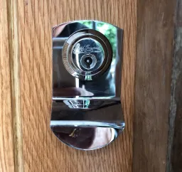 Bramah high-security lock and escutcheon fitted to a solid oak front door
