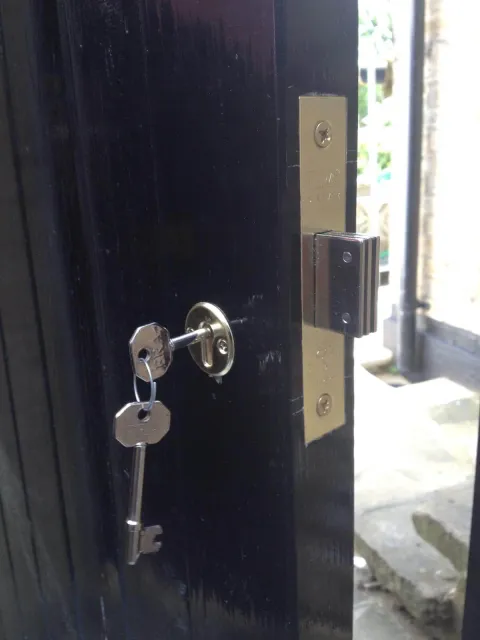 ERA five-lever BS-standard mortice deadlock and keys fitted to a black timber door in Winchmore Hill