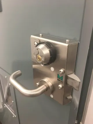 Heavy-duty commercial lock case fitted to a steel security door