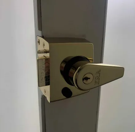 Brass ERA nightlatch case on the inside face of the door after the upgrade