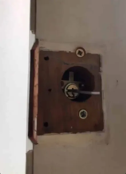 Old rim lock stripped back to the timber during a lock upgrade