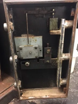 Lever mechanism of an antique safe lock exposed during opening