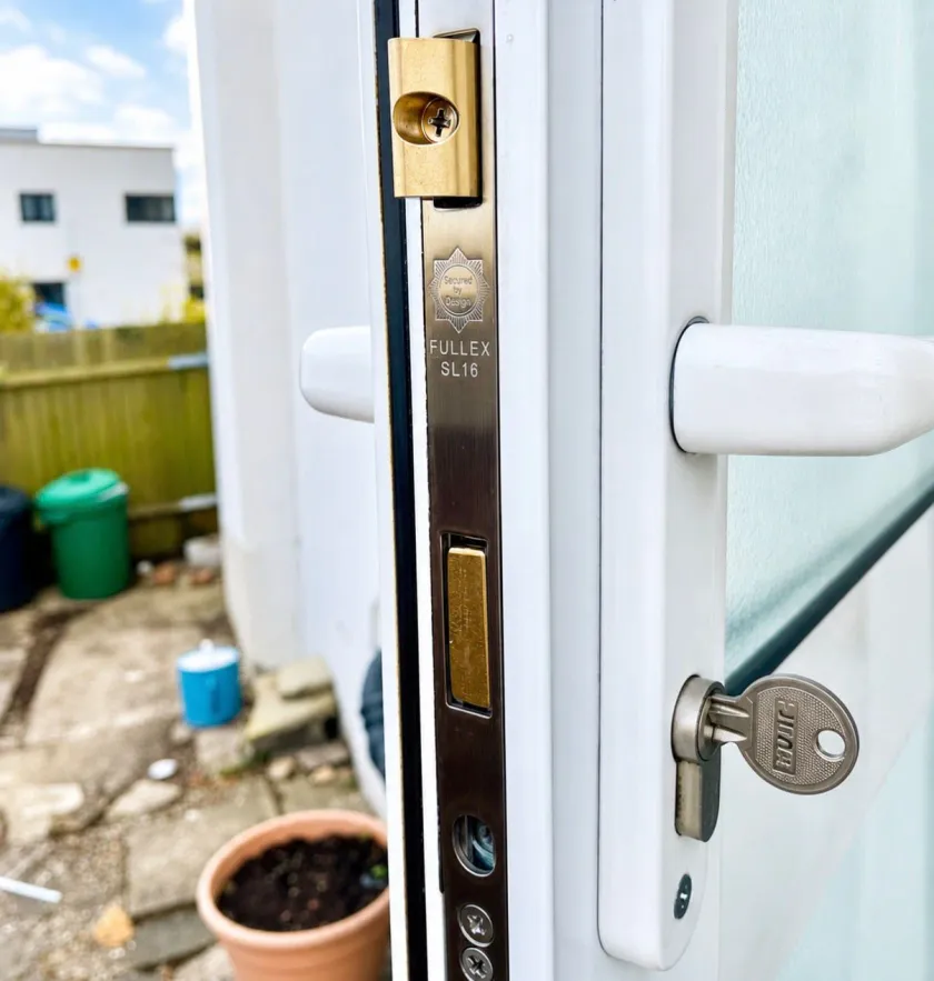 Fullex SL16 multipoint lock strip and new euro cylinder on a white uPVC door in Northwood