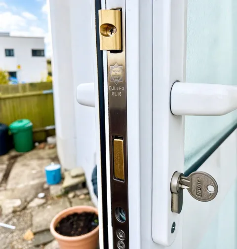 Fullex SL16 multipoint lock strip and new euro cylinder on a white uPVC door in Northwood